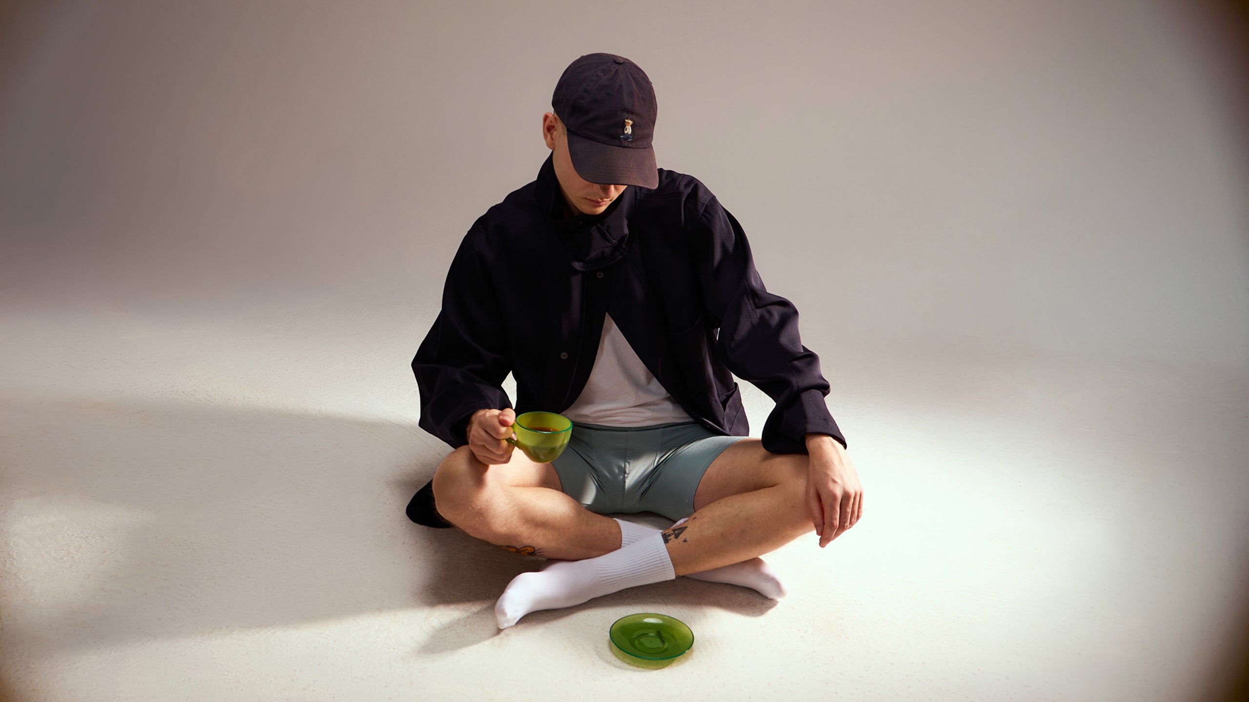 Guy sitting on the floor wearing Booie Boxer