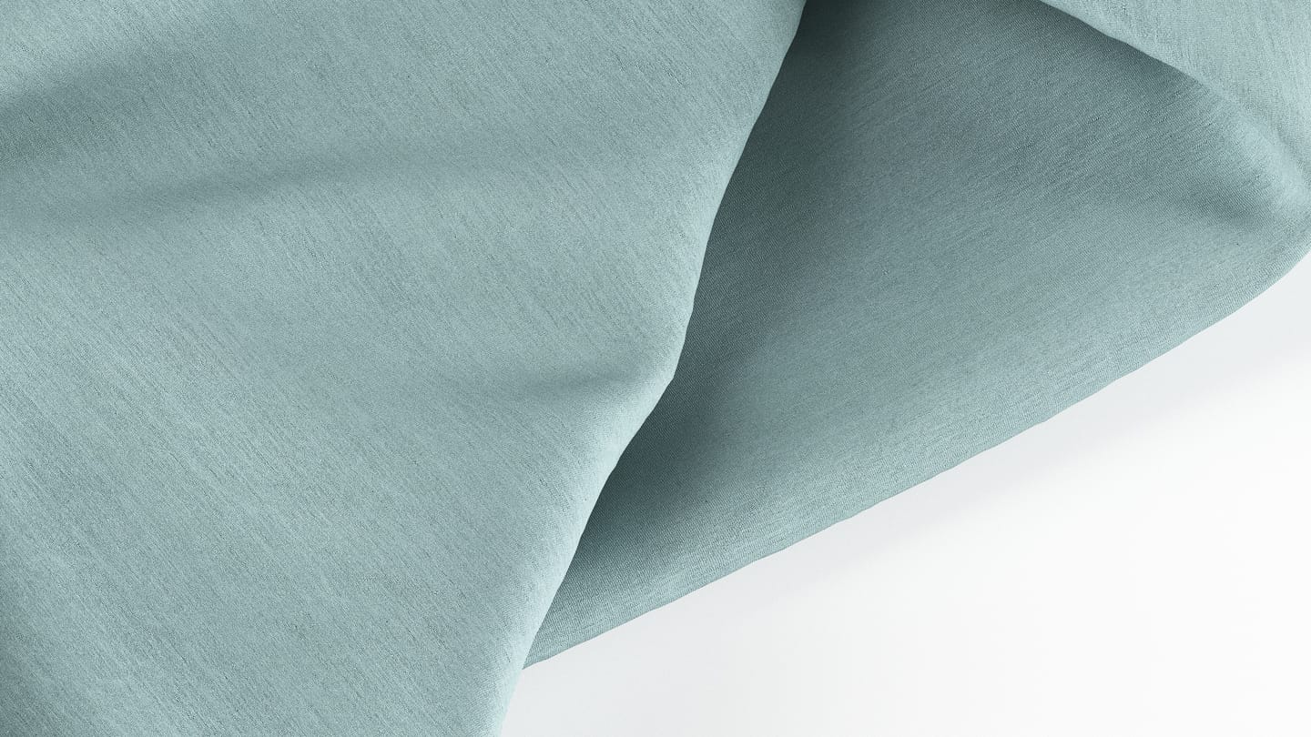Close-up of light blue fabric on a white background